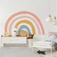 Pastel rainbow wall mural with curved semicircular stripes in pink, yellow, and gray tones.